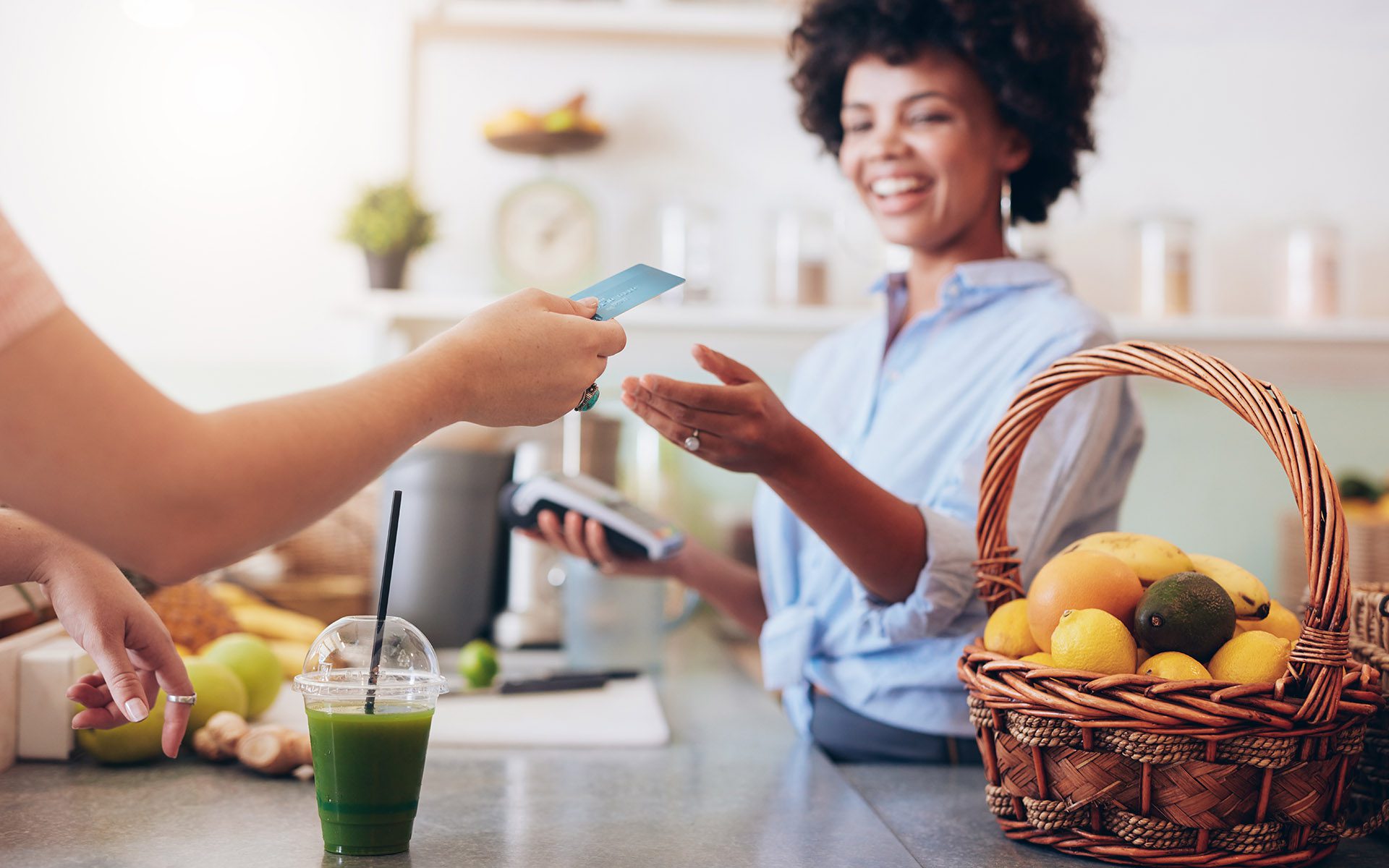 Landing Page #2 - Woman Exchanging Money at the Counter for a Smoothie